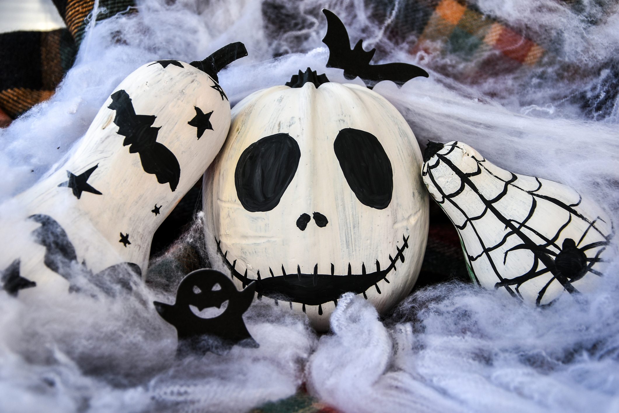 painted face pumpkin and bats and spiders