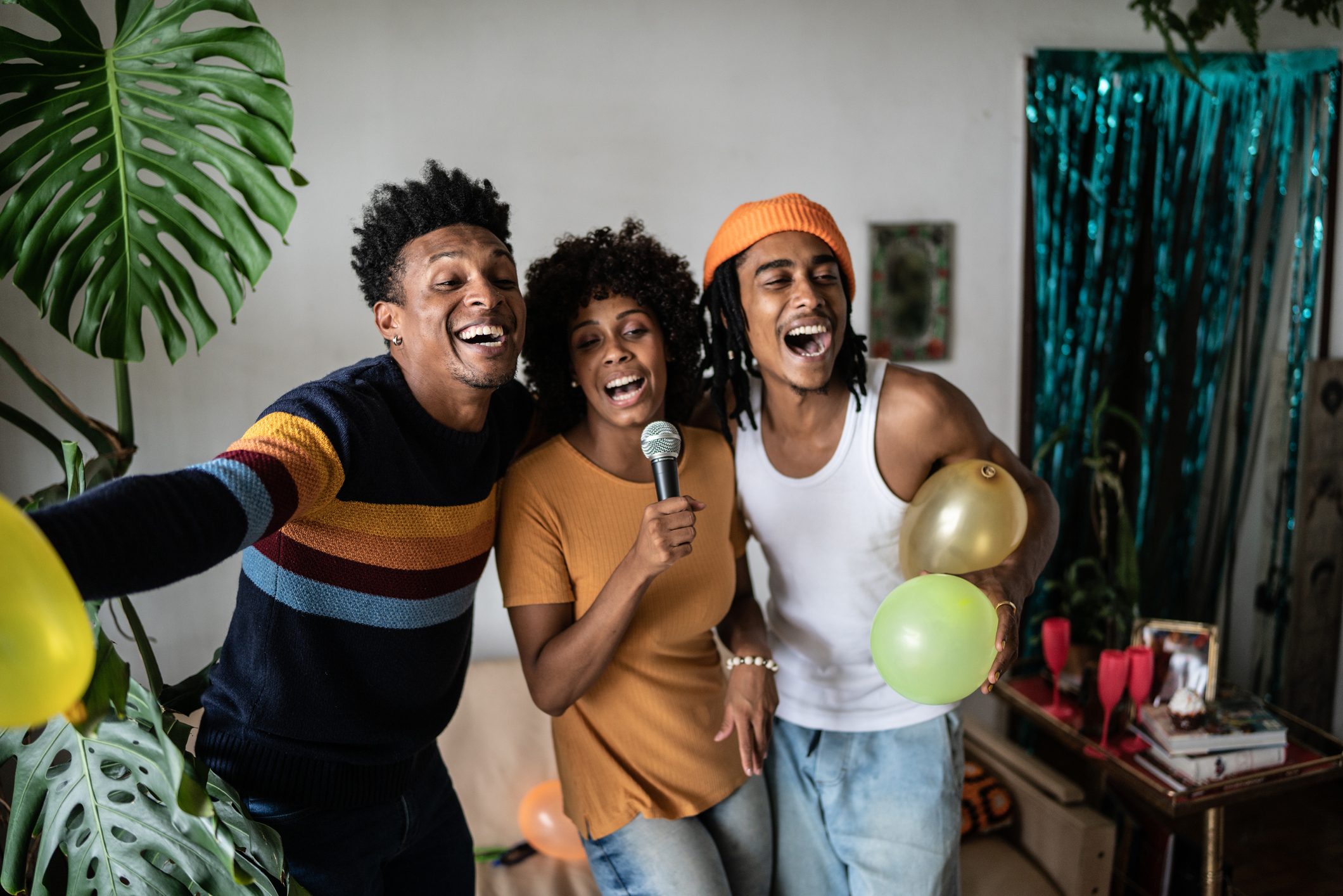 Friends singing together at home