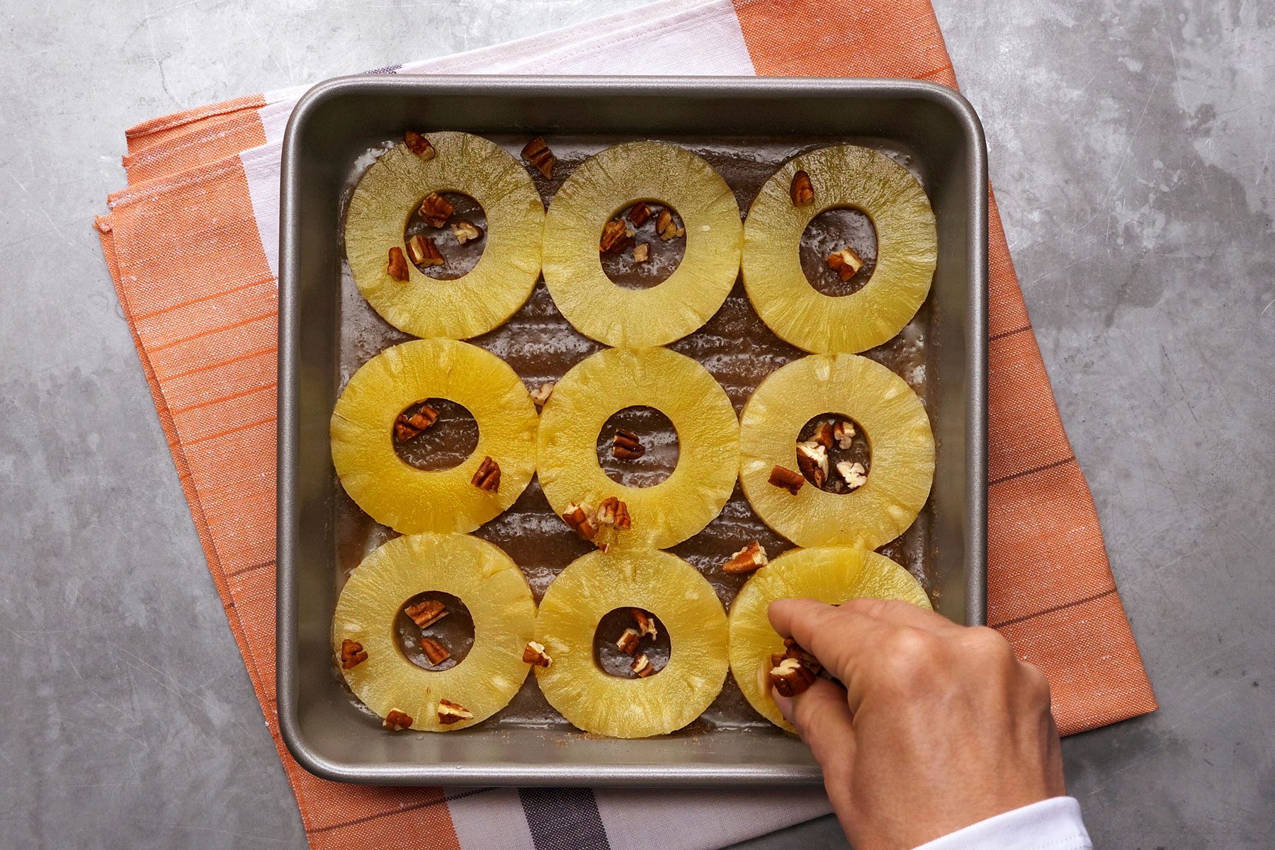 Adding Pecan nuts on pineapples