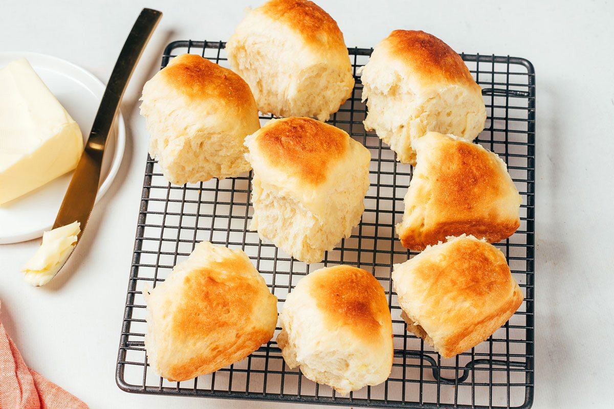Freshly baked potato rolls cooling on rack, recipe by Taste of Home