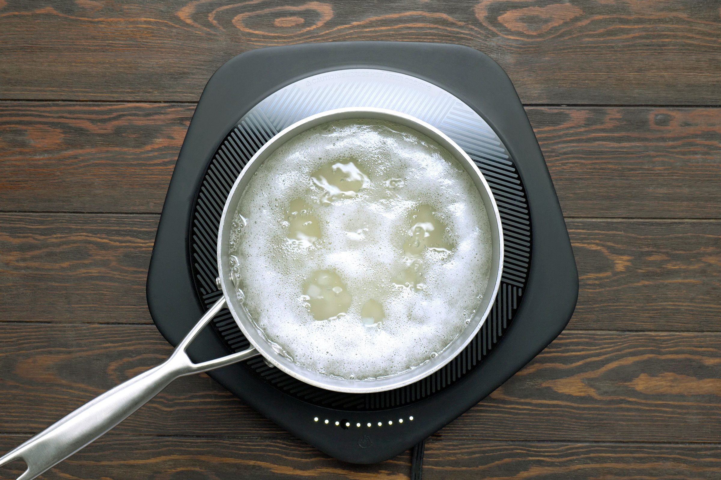 A saucepan of boiling water for potatoes