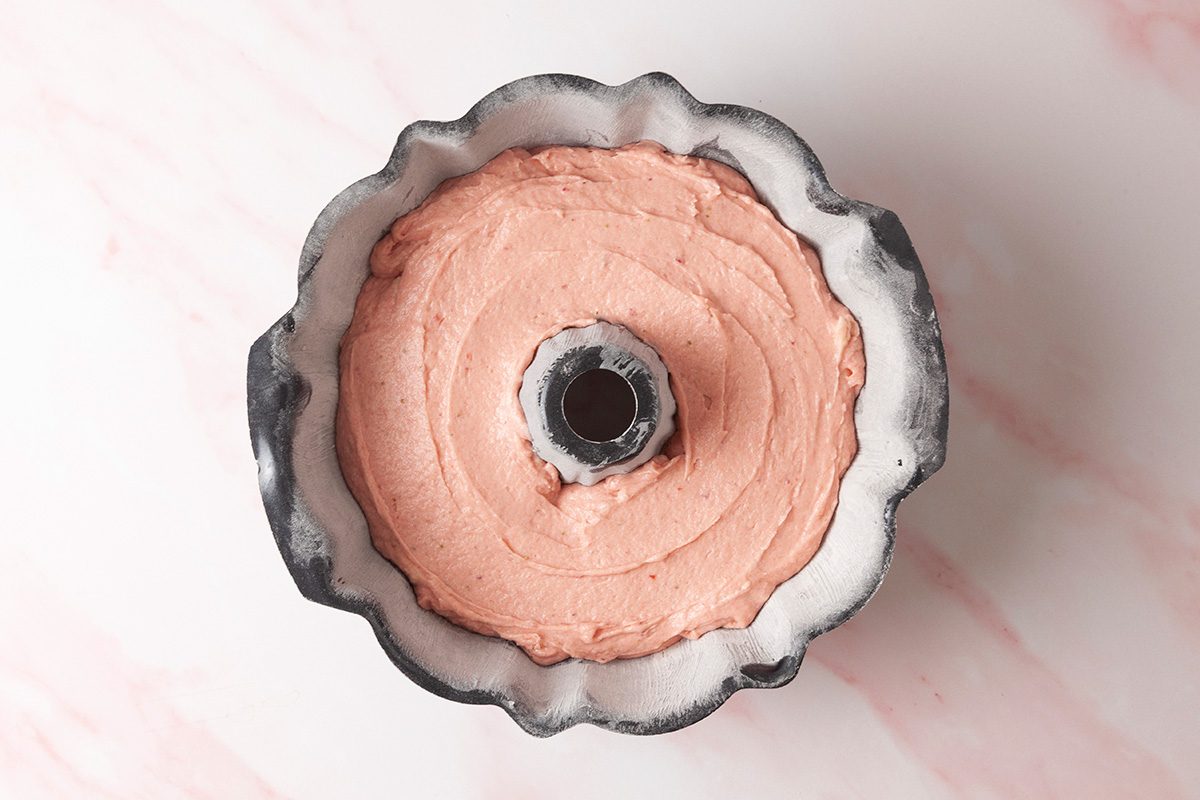 Pour batter into the prepared Bundt pan