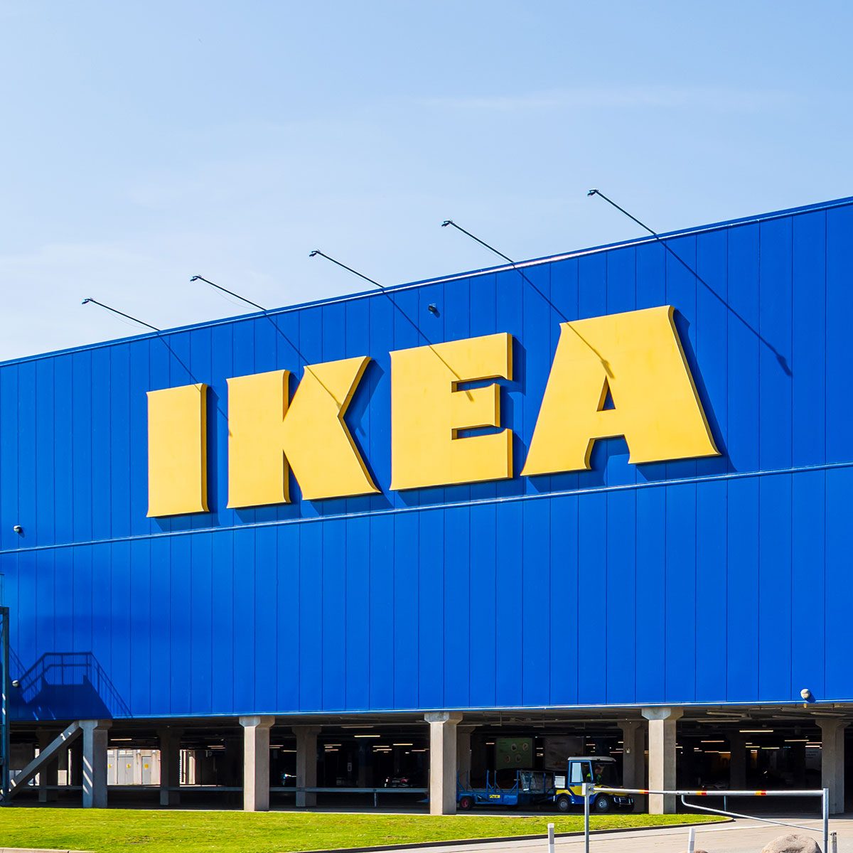 Large IKEA signs on the blue facade of an IKEA store.