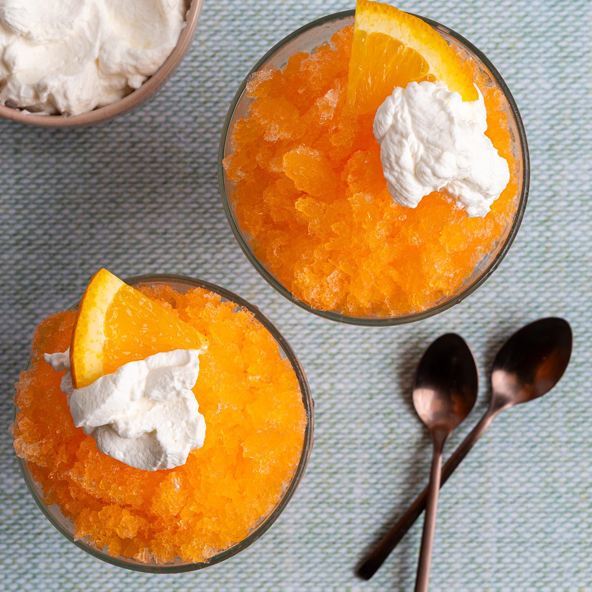 Orange Soda Granita with Whipped Cream and an Orange Slice on top